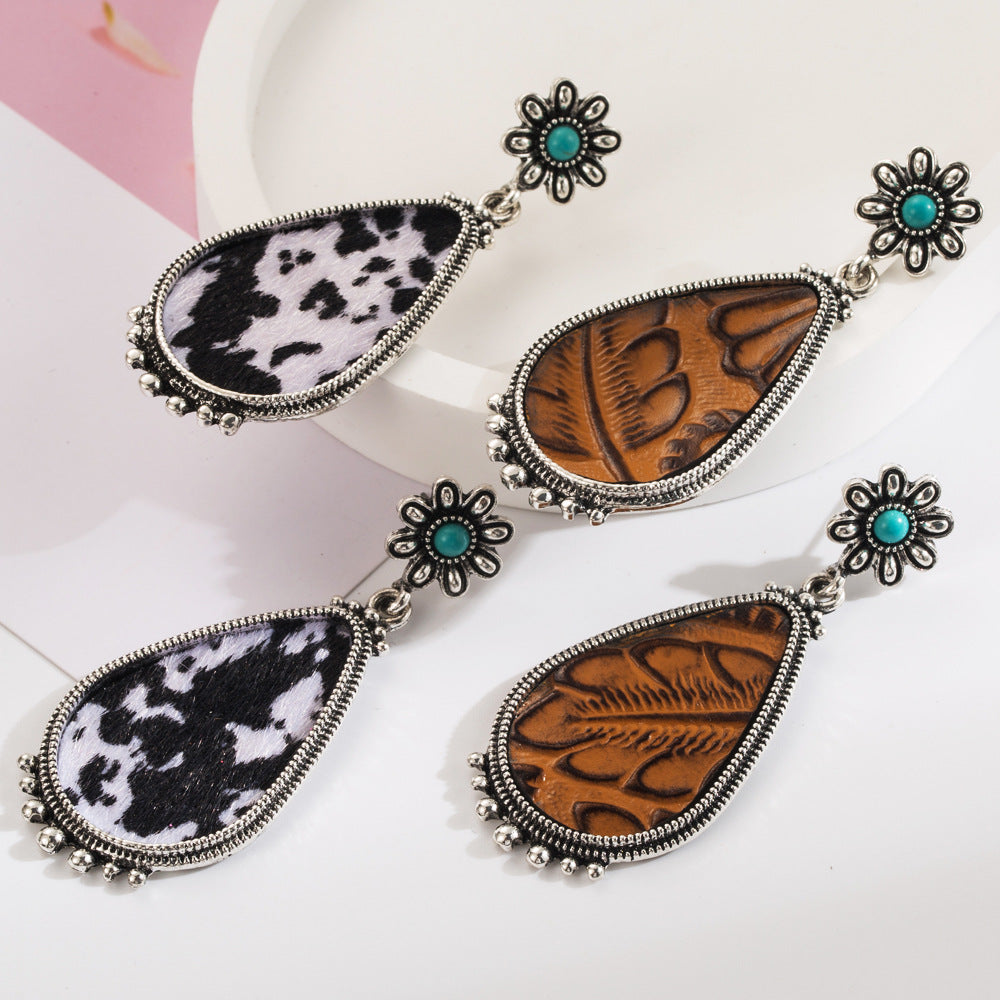 Cross-border new retro leopard print exaggerated leather earrings, alloy inlaid white green pine trend earrings, independent station hit