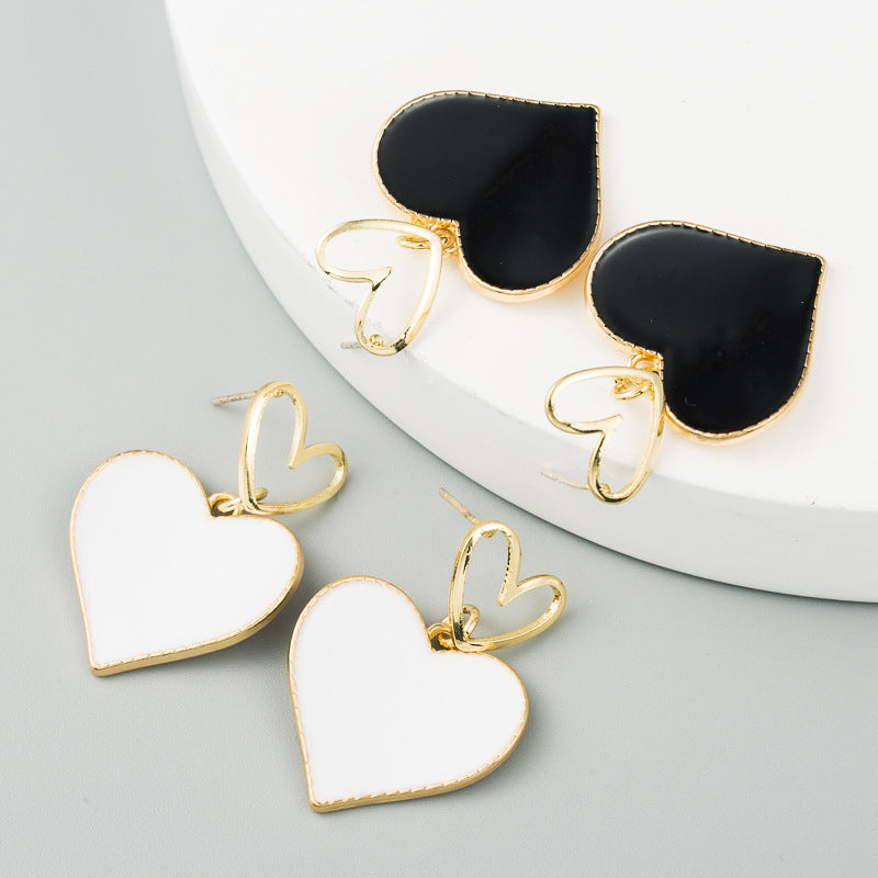 South Korea Dongdaemun small fresh double heart earrings heart-shaped dripping oil hollow alloy earrings women's S925 silver needle earrings