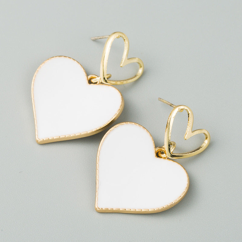 South Korea Dongdaemun small fresh double heart earrings heart-shaped dripping oil hollow alloy earrings women's S925 silver needle earrings