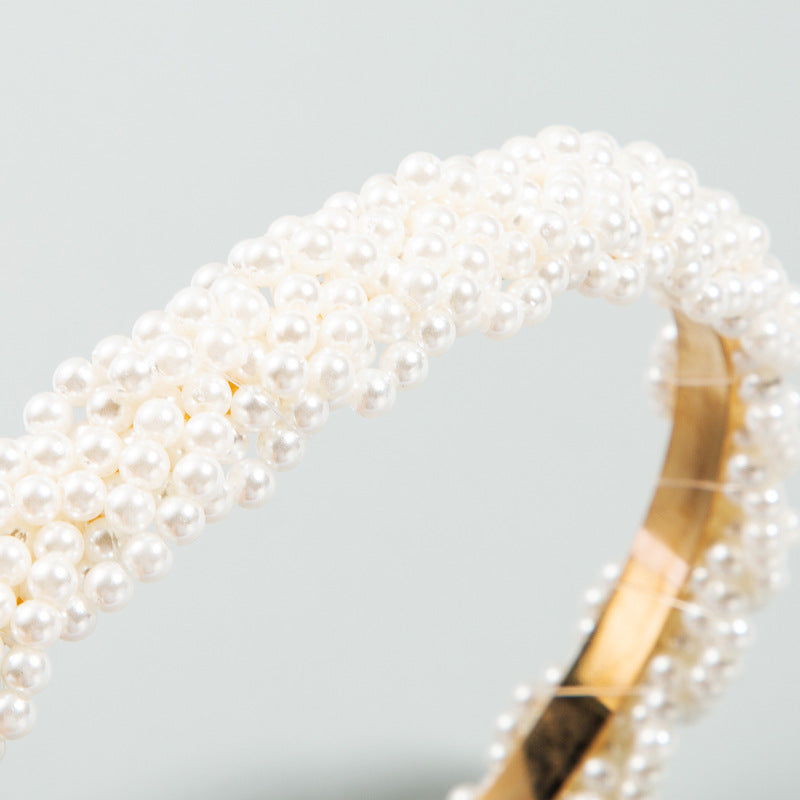 The Korean version is fashionable and beautiful, full of pearl headbands, and the girl is super immortal, and the headband temperament is versatile, and the European and American simple headbands are used