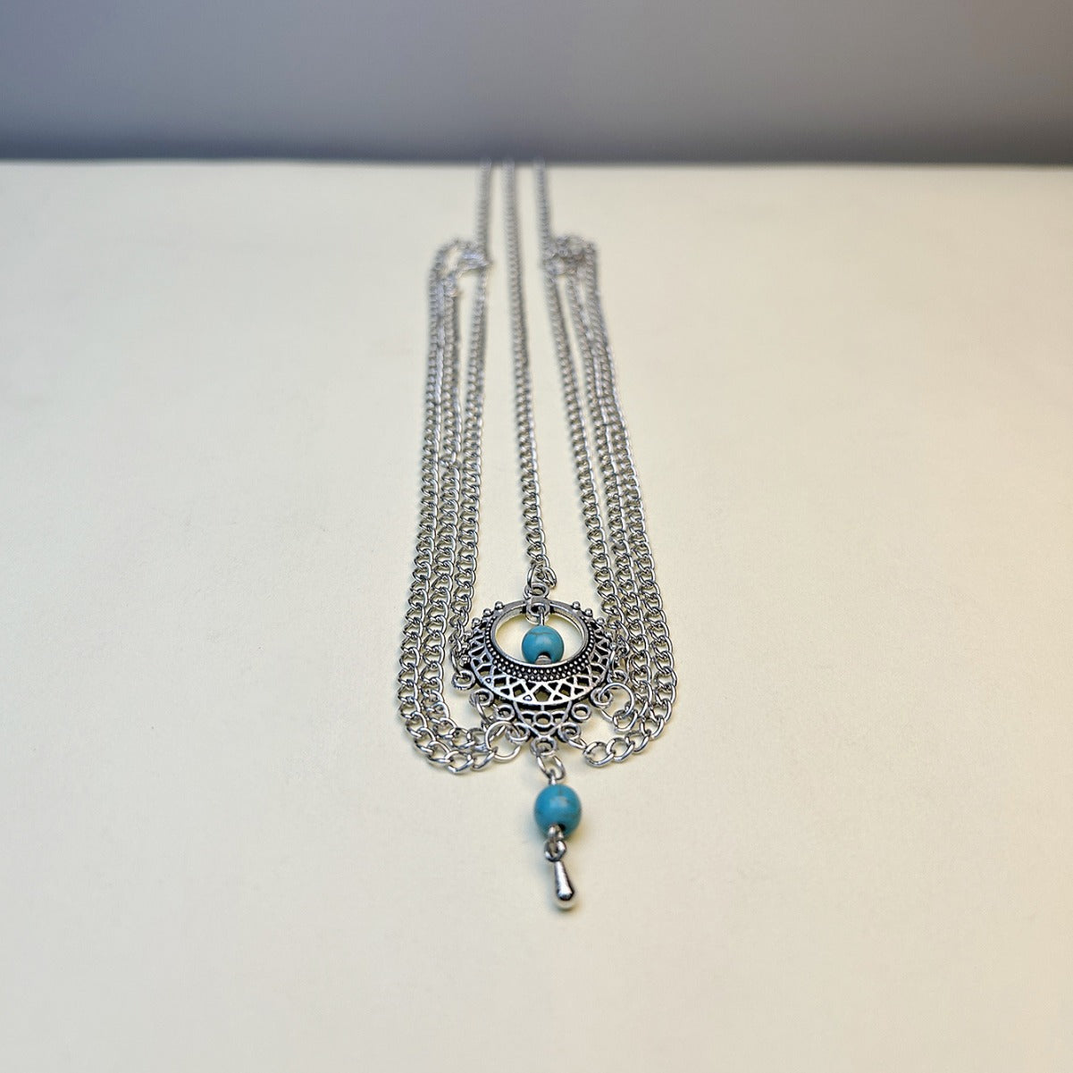 The new foreign trade hair ornament is European and American retro ethnic style hollow turquoise water drop tassel multi-layer simple hair head bracelet