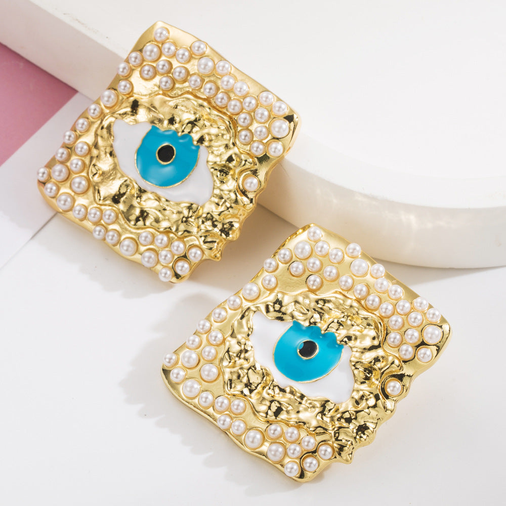 European and American fashion trend alloy dripping oil eye stud earrings inlaid with pearls personality exaggerated s925 silver needle party earrings female