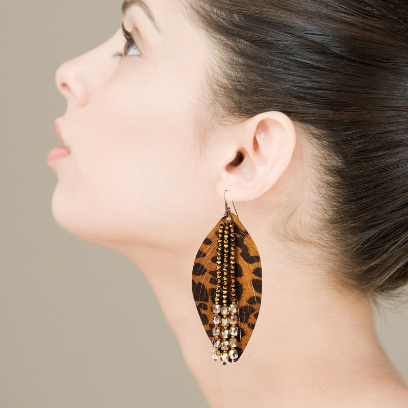 Cross-border hot personality leather earrings, leaf-shaped leopard leather crystal tassels, high-quality niche exaggerated earrings