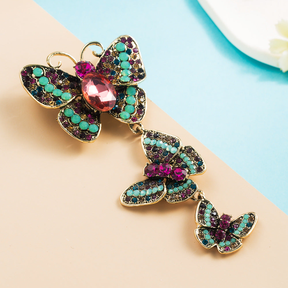 European and American retro fashion, new niche alloy diamond-studded butterfly, long brooch, corsage, high-end trend jewelry