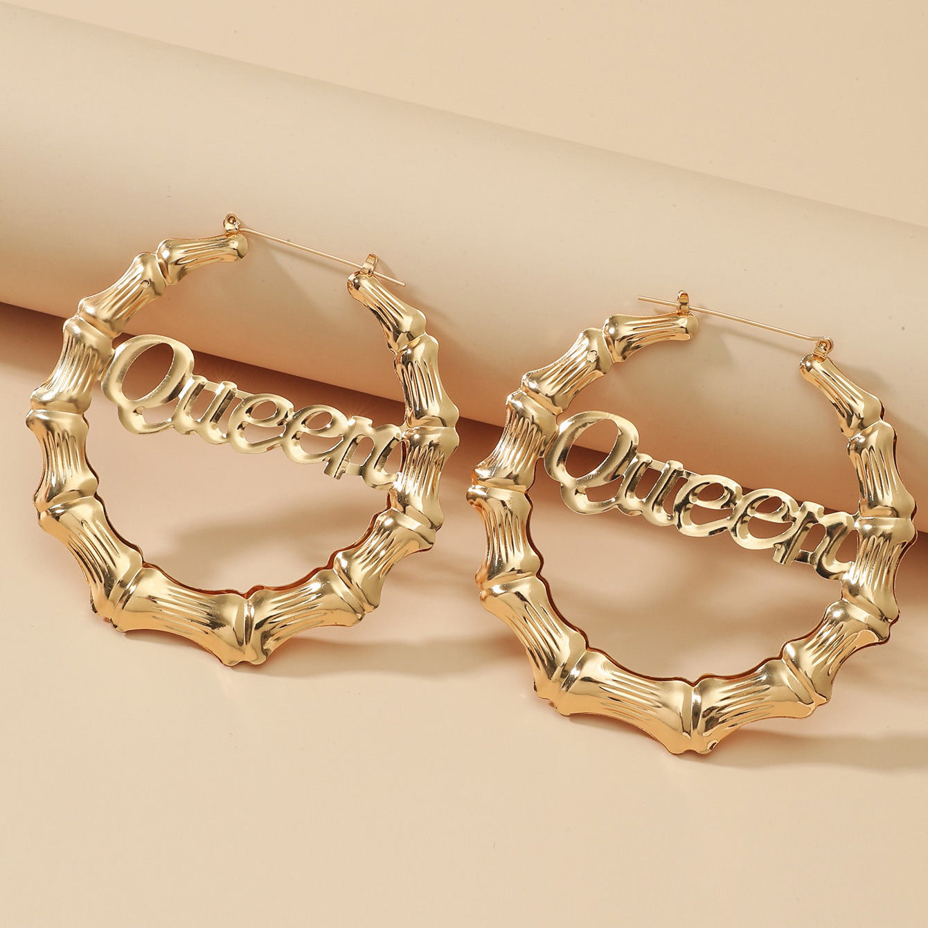 The new European and American jewelry round bamboo letter earrings have an exaggerated personality, metal design, and large earring earrings