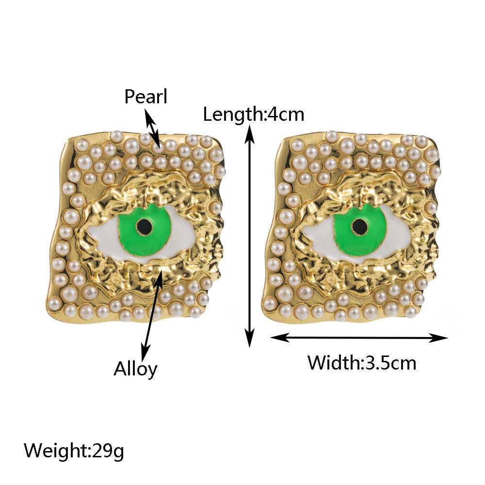 European and American fashion trend alloy dripping oil eye stud earrings inlaid with pearls personality exaggerated s925 silver needle party earrings female