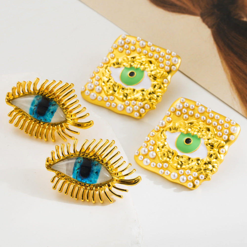 European and American vintage antique gold exaggerated devil's eye silver needle earrings female alloy dripping oil inlaid resin pearl earrings