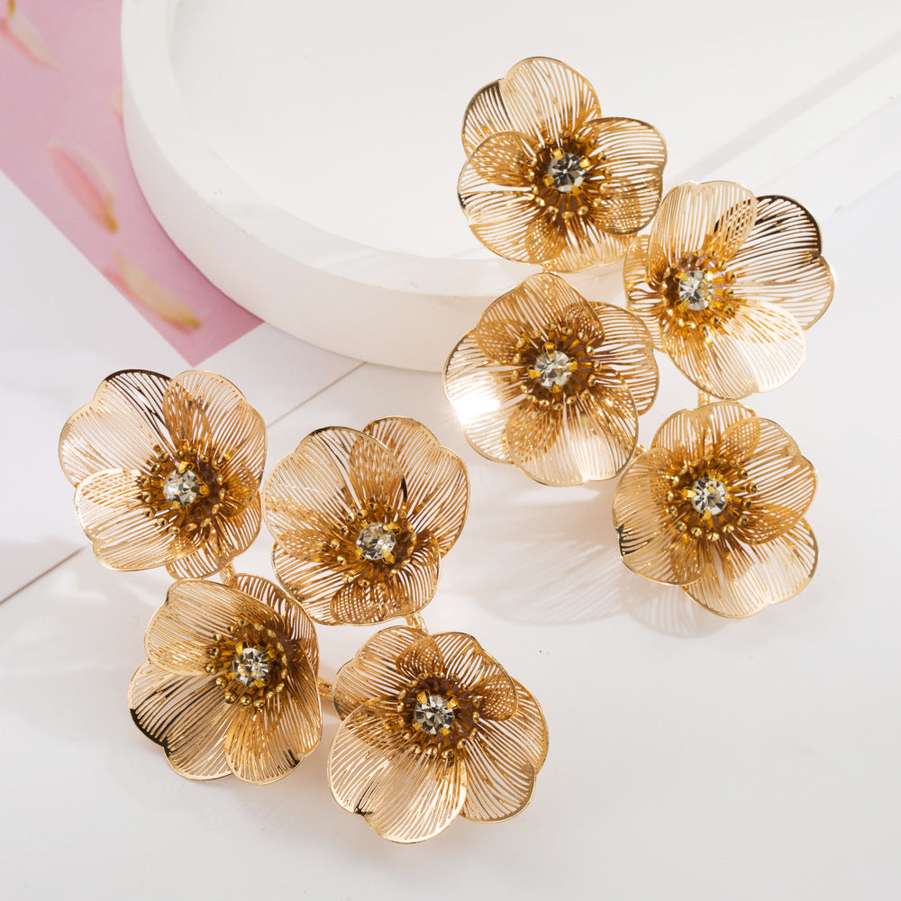 European and American cross-border new diamond-inlaid alloy flower earrings, women's light luxury trend, hollow texture, high-end evening earrings