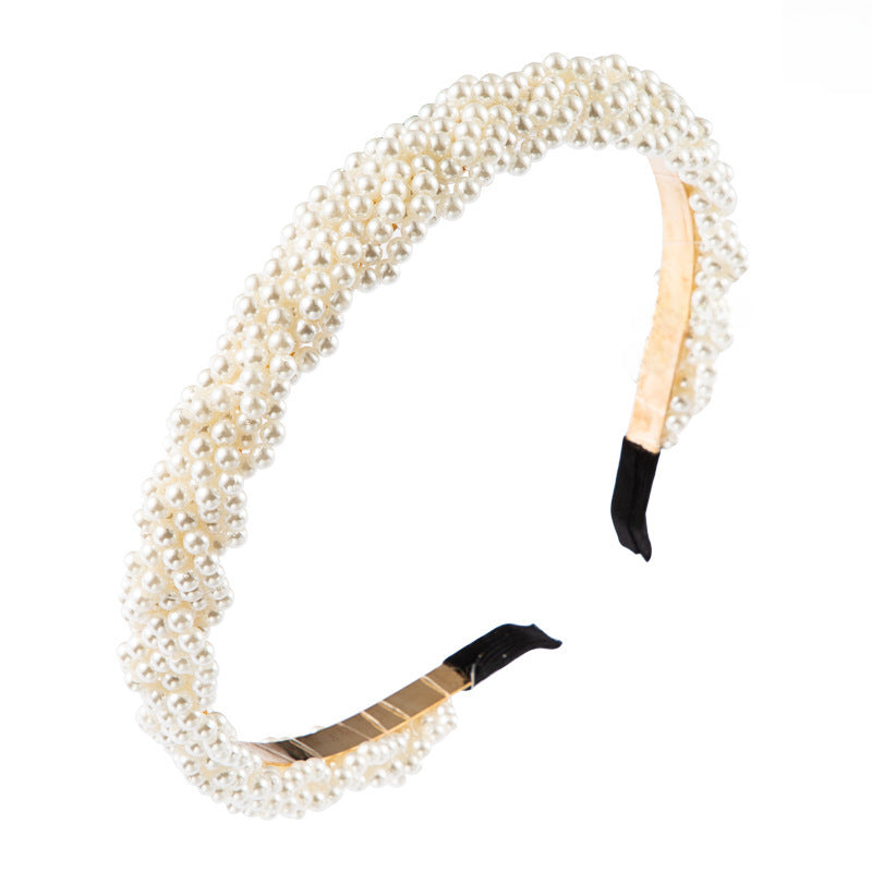 The Korean version is fashionable and beautiful, full of pearl headbands, and the girl is super immortal, and the headband temperament is versatile, and the European and American simple headbands are used