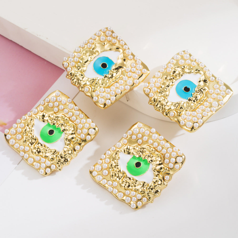 European and American fashion trend alloy dripping oil eye stud earrings inlaid with pearls personality exaggerated s925 silver needle party earrings female