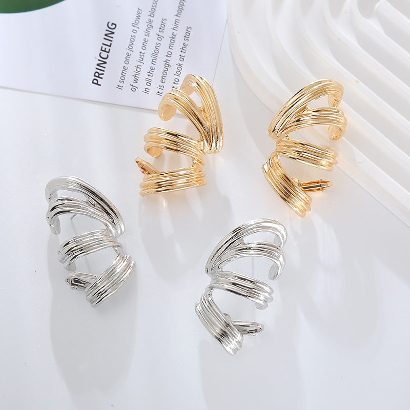 European and American new exaggerated spring-like alloy threaded silver pin earrings women's personality simple twist earrings earrings wholesale