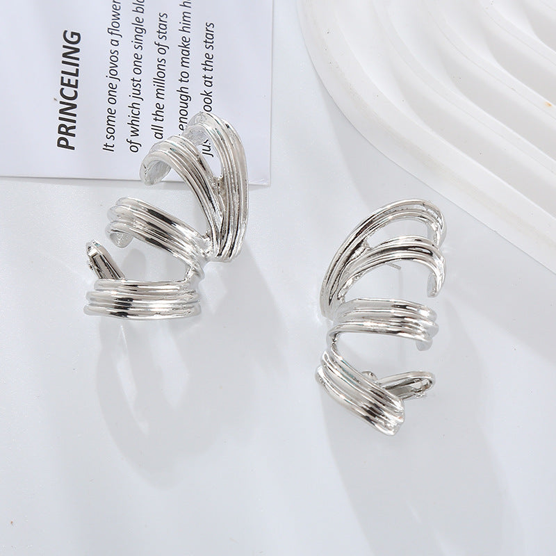 European and American new exaggerated spring-like alloy threaded silver pin earrings women's personality simple twist earrings earrings wholesale