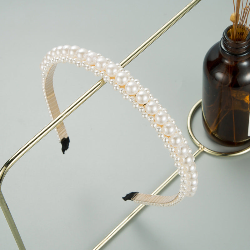 Korean version of sweet temperament, metal pearl entwined thin headband, European and American ins, fashionable, simple bridal headband hair accessories