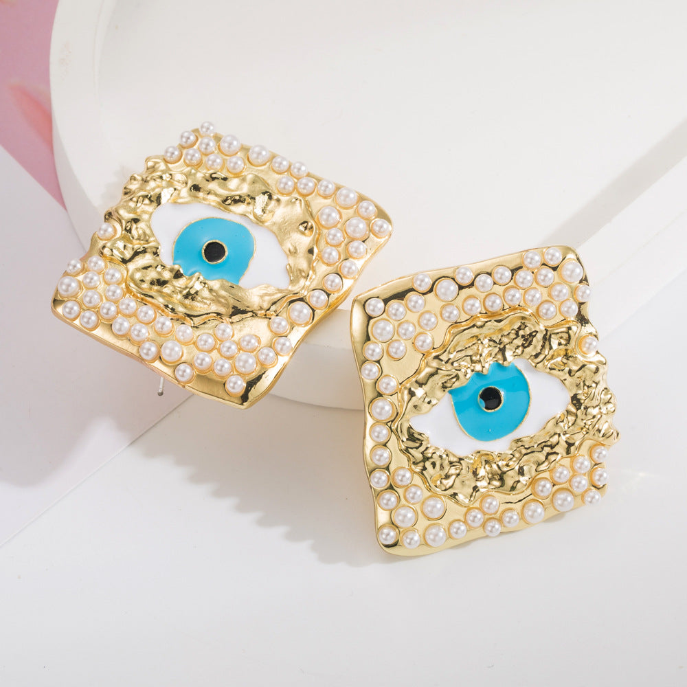 European and American fashion trend alloy dripping oil eye stud earrings inlaid with pearls personality exaggerated s925 silver needle party earrings female