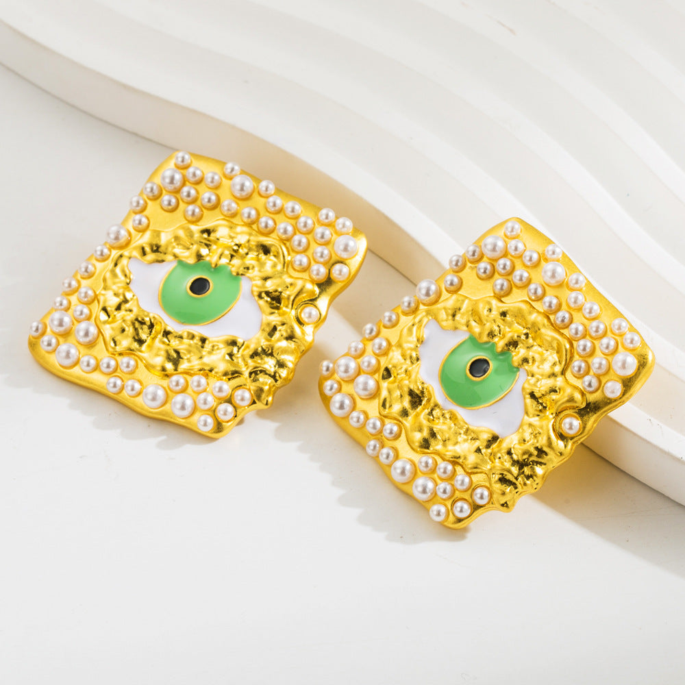 European and American vintage antique gold exaggerated devil's eye silver needle earrings female alloy dripping oil inlaid resin pearl earrings