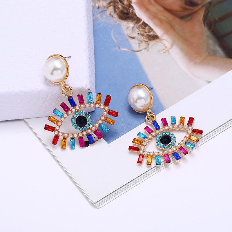 European and American fashion exaggerated devil's eye, pearl alloy earrings, women's colored diamonds, super flash, personality Internet celebrity earrings, earrings